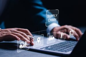 hands on laptop working on supply chain forecasting