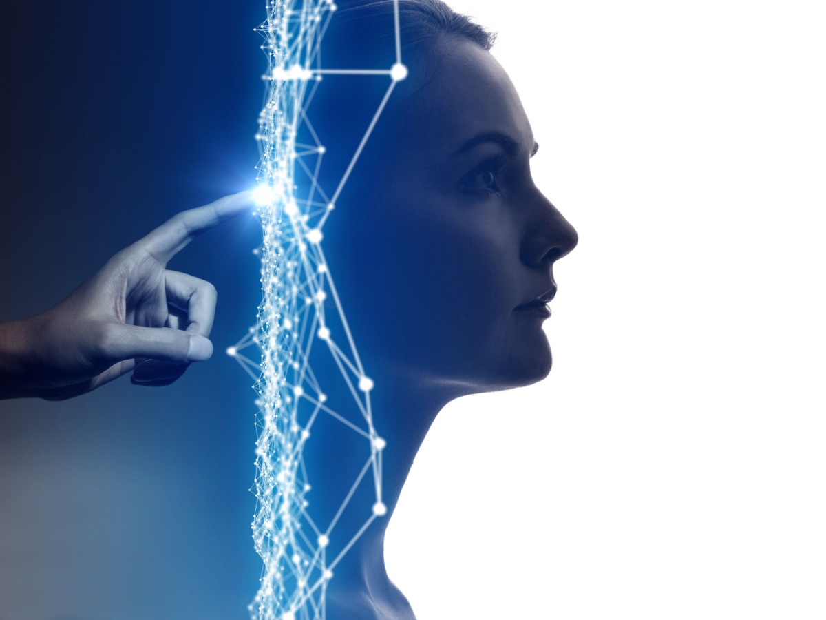 A hand touches a glowing network of connected points beside a woman's profile, representing DFM AI.